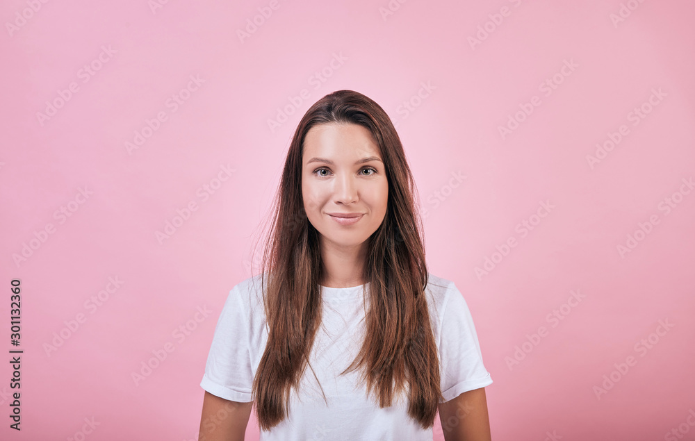 Cute calm attractive girl in a white T-shirt Cute calm attractive girl in a white T-shirt