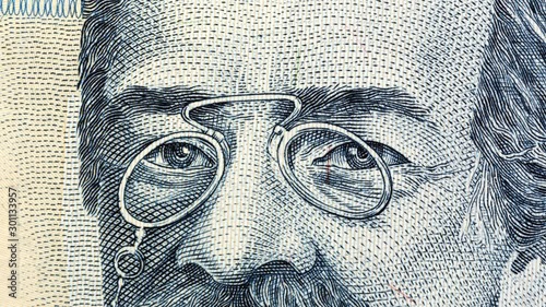 Eyes from portraits painted on money. Currency stop motion. World money detail.