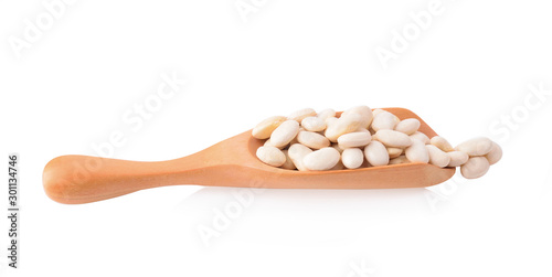 White beans in a spoon isolated on a white background