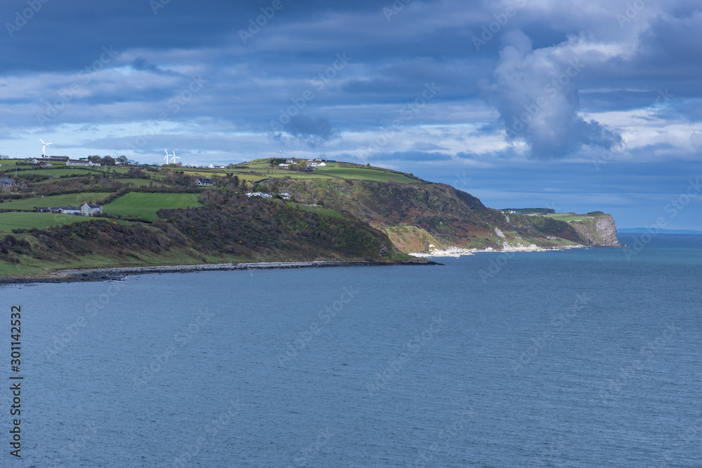 Islandmagee coastline at entrance to The Gobbins cliffpath on the Irish Sea, County Antrim, Northern Ireland, viewed from Blackhead Lighthouse