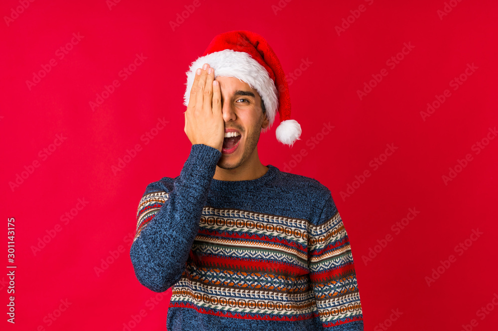 Young man on christmas day dreaming of achieving goals and purposes