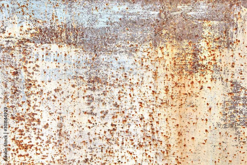 Faded paint rusty sheet of metal abstract texture.