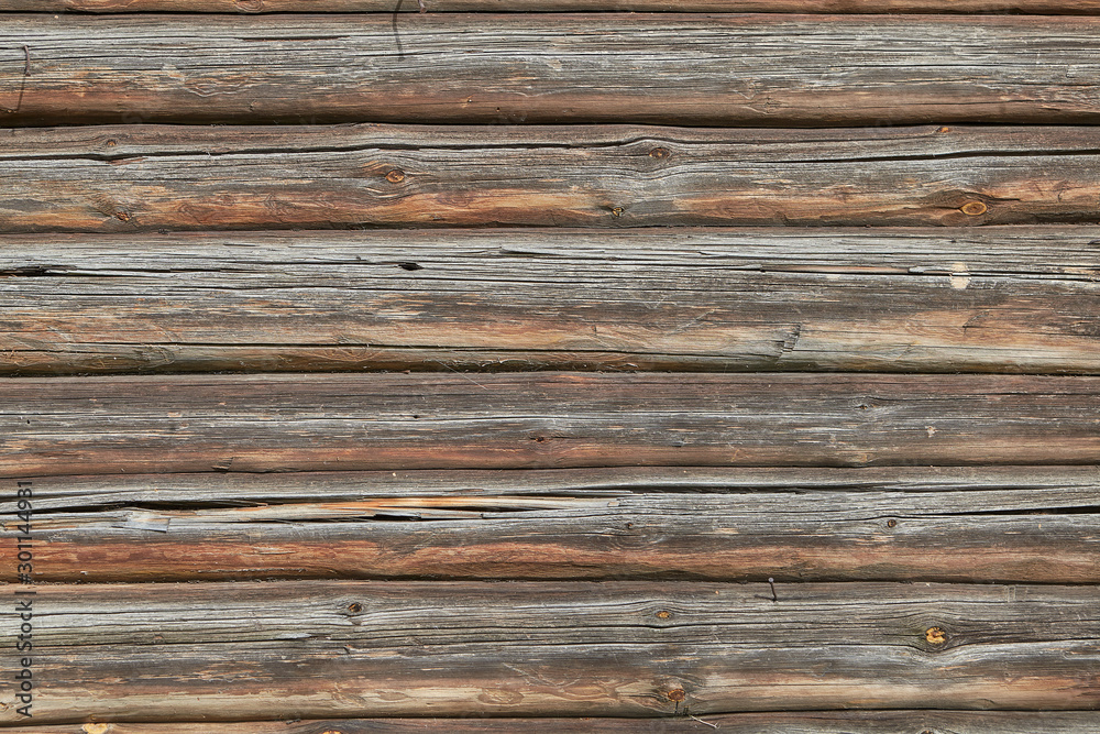 Wall of old cracked pine logs texture for backdrop. Wall of old cracked pine logs texture for backdrop.