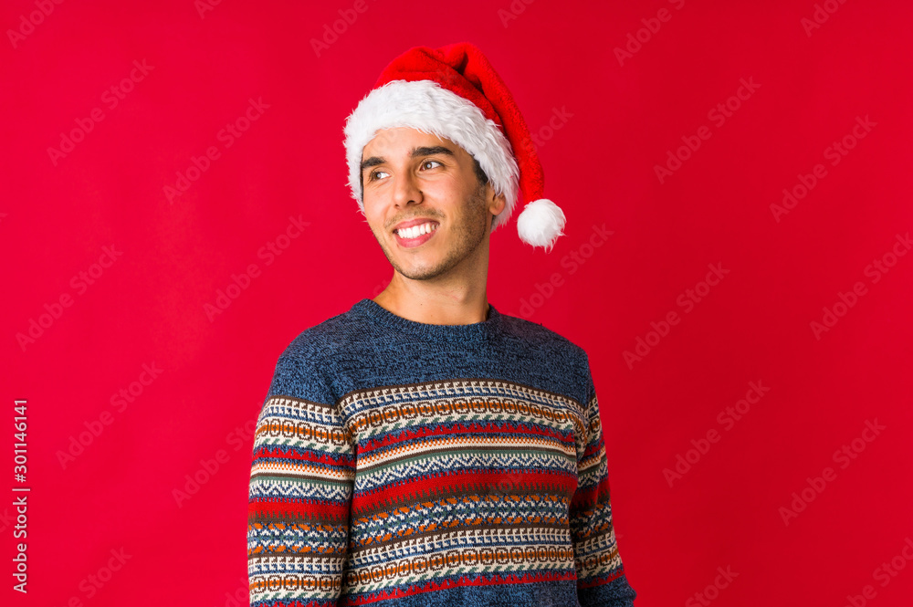 Young man on christmas day being shocked due to an imminent danger Young man on christmas day being shocked due to an imminent danger