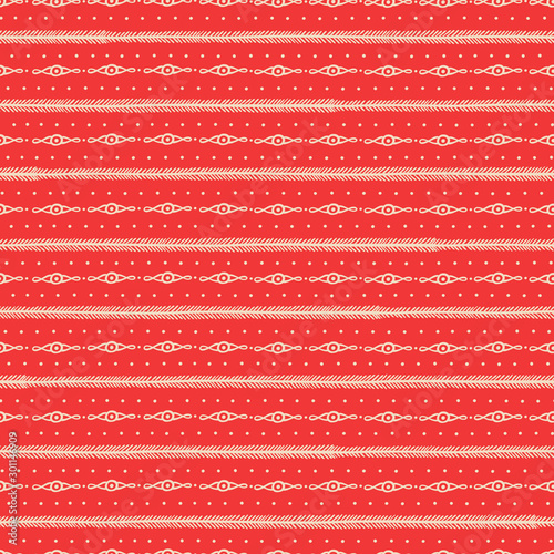 Seamless Christmas pattern with ornamentl lines and dots on red background. photo