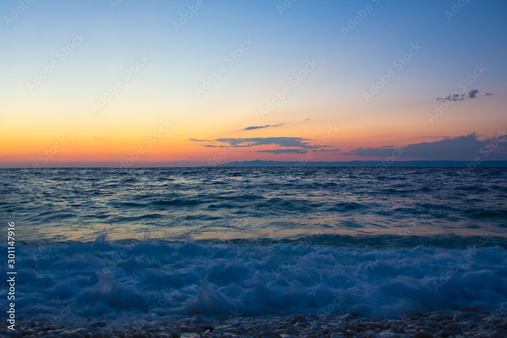 Beautiful seascape sunset. Sunset scene in the sea.