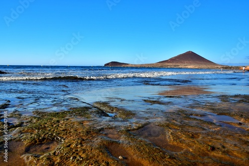 Rocks and puddles at low tide in El Medano