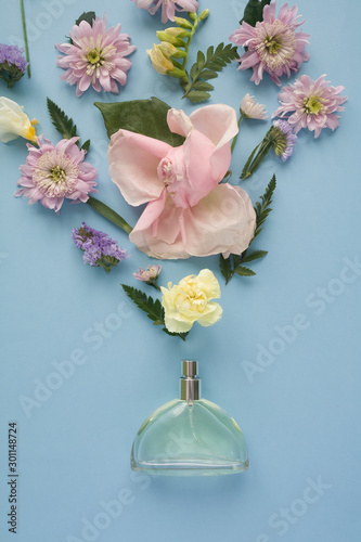 Wallpaper Mural Flower arrangement. Flowers, fragrance, perfume on blue background. Torontodigital.ca