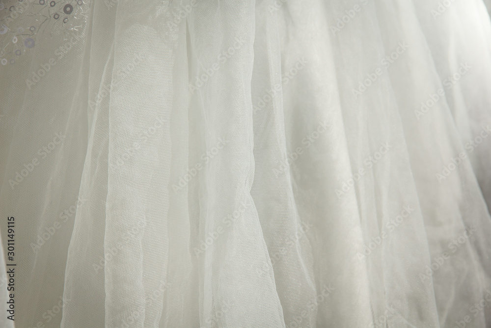 Obraz premium Details of the bride dress fabric and beautiful embroidery wedding concept used as a background for illustrations and text.