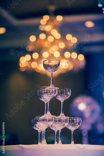 A glass of champagne at a party celebrating the wedding