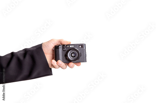 male hand holding a camera isolated on white photo