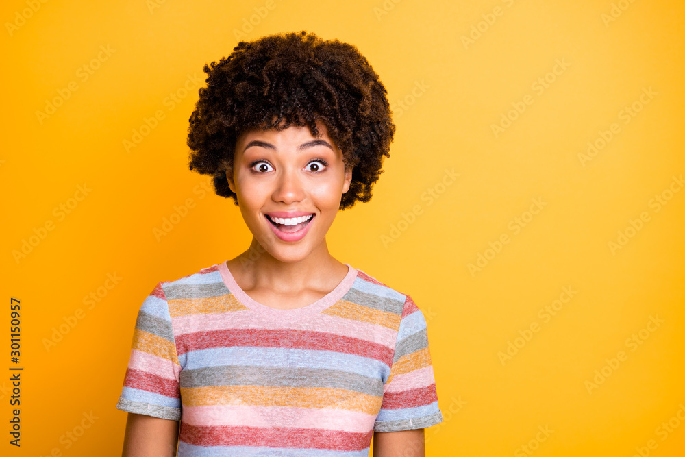 Photo of beautiful dark skin wavy lady looking shopping banner overjoyed with discount prices wear casual striped t-shirt isolated yellow background Photo of beautiful dark skin wavy lady looking shopping banner overjoyed with discount prices wear casual striped t-shirt isolated yellow background