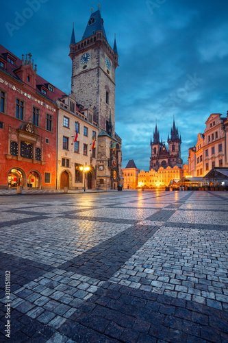 Prague, Czech Republic. Cityscape image of famous Old Town Square with the Prague Astronomical Clock and Old Town Hall during twilight blue hour. 