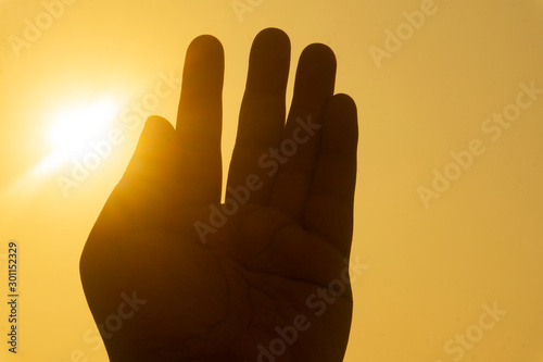 hand sign silhouette at sunset
