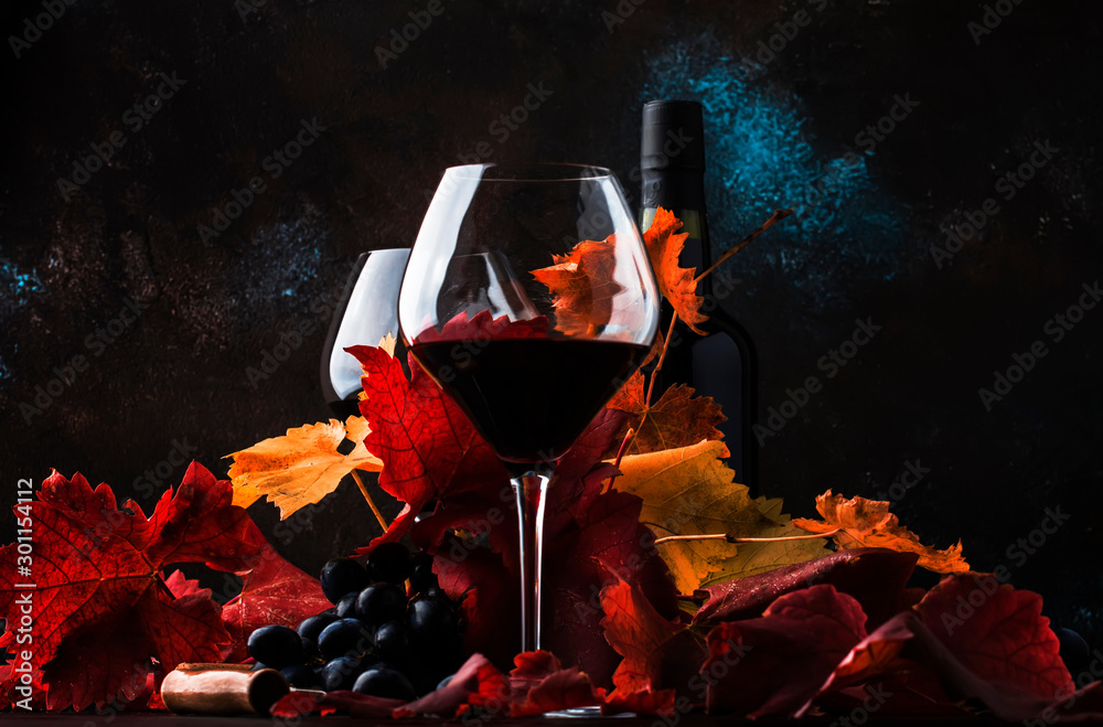 Dry Red Wine in big wine glass, autumn still life with leaves, wine tasting concept, rustic style, selective focus - obrazy, fototapety, plakaty 