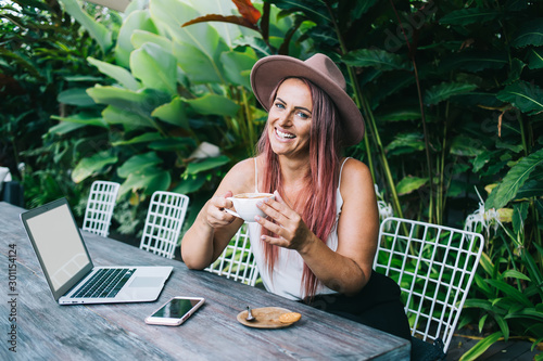 Lady with mug of coffee enjoying break