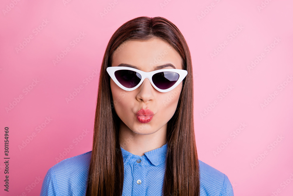 Close up photo of charming flirty cute attractive gorgeous business woman having relax fun abroad wearing sunglass eyewear with lips pouted isolated over pink pastel color background Close up photo of charming flirty cute attractive gorgeous business woman having relax fun abroad wearing sunglass eyewear with lips pouted isolated over pink pastel color background