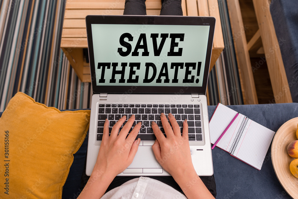 Fototapeta premium Conceptual hand writing showing Save The Date. Concept meaning reserve the mentioned future wedding date on their calendar woman with laptop smartphone and office supplies technology