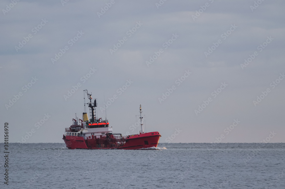 OIL TANKER - Bunker ship with fuel load on the waterway in the sea OIL TANKER - Bunker ship with fuel load on the waterway in the sea