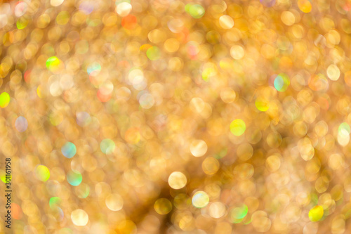 Abstract blurred colorful bokeh background, festive season background, shiny gold bokeh background