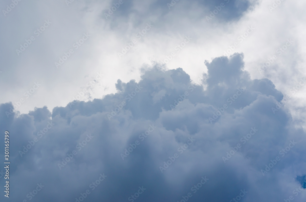 Obraz premium Dark Cumulus Clouds in the Blue Sky