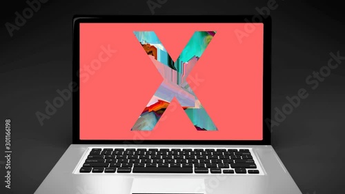 Letter X on computer laptop evoking -18 sexual content on internet, X-rated