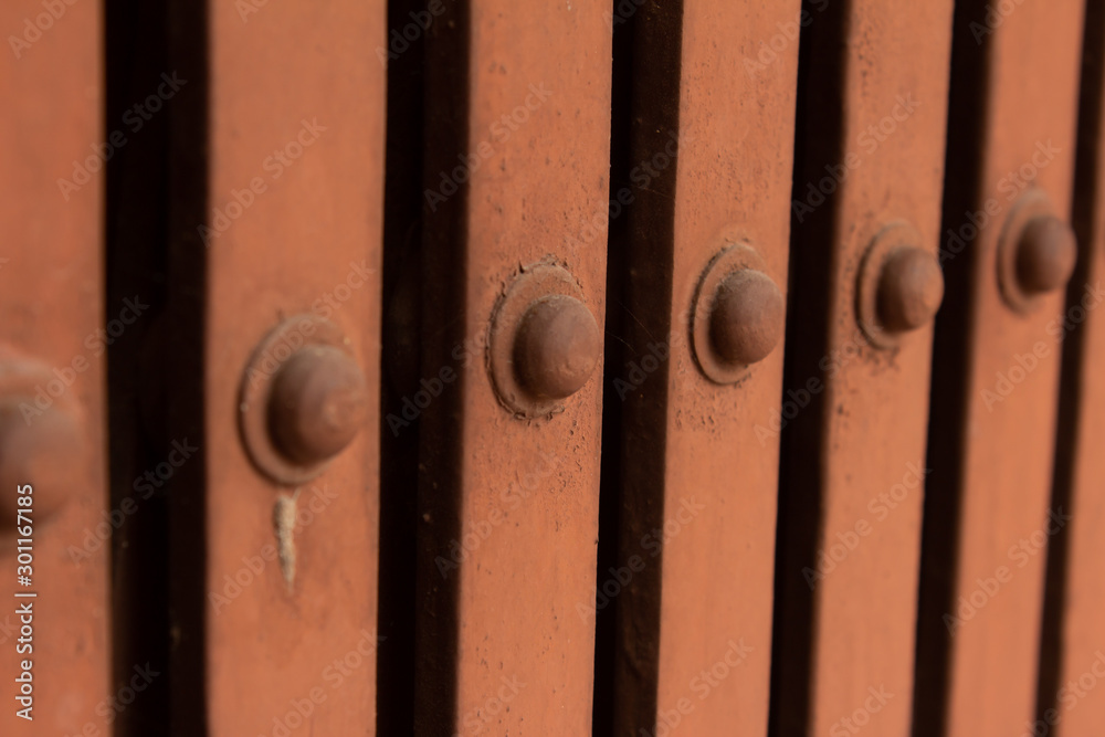 Obraz premium Rivets along the collapsible gate used for additional security for homes and businesses