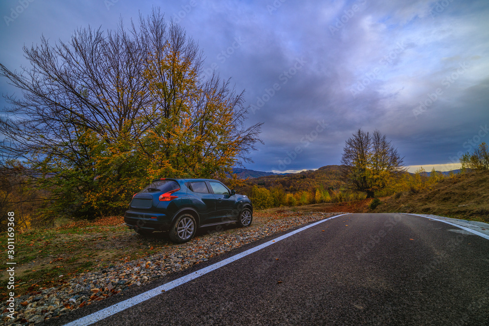 mountain road during autumn on a cloudy day