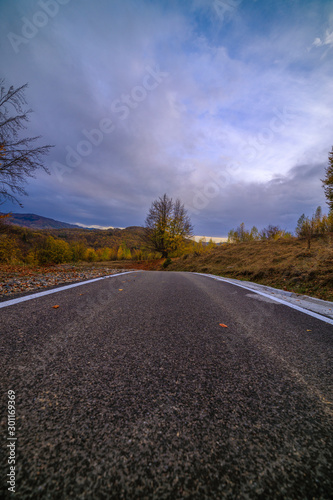 mountain road during autumn on a cloudy day