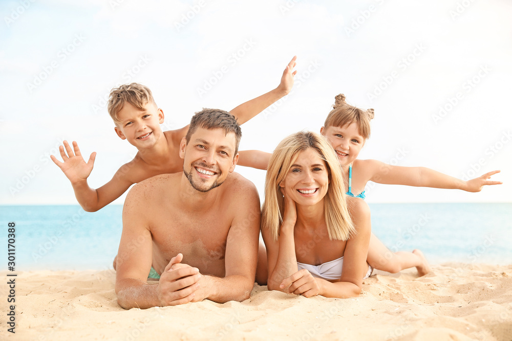 Portrait of happy family on sea beach Portrait of happy family on sea beach