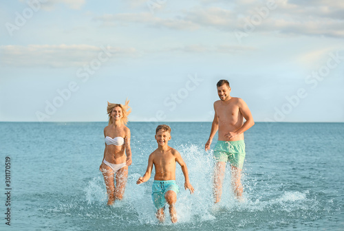 Happy family resting at sea...
