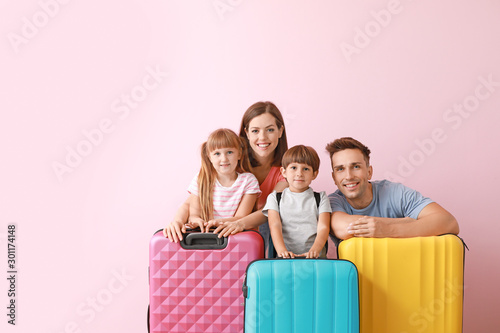 Happy family with luggage o...