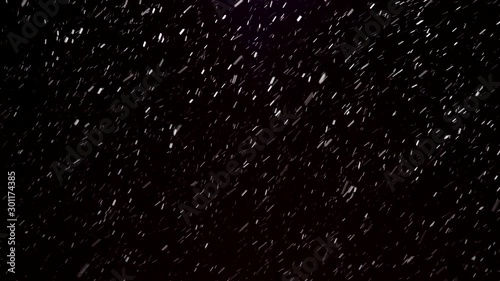 Winter falling snow isolated on a black background for animation graphics and composition. Blizzard, big and small snowflakes, real, intense. 4k footage.