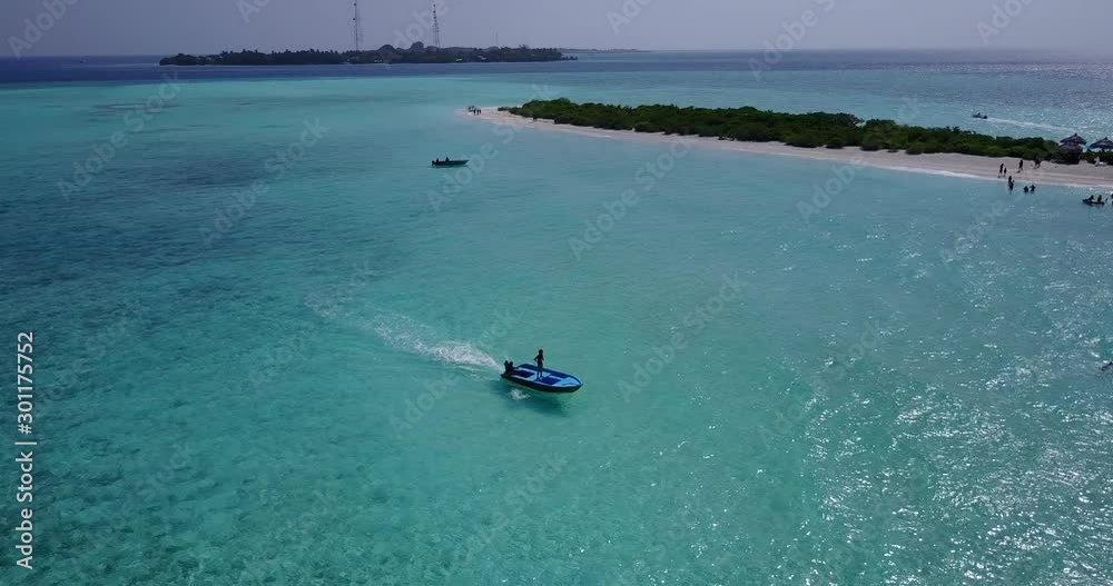 motorboat driving on sunny day in bali, paradise island with people sunbathing on beach, drone motorboat driving on sunny day in bali, paradise island with people sunbathing on beach, drone