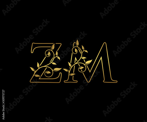 Golden letter Z and M, ZM vintage decorative ornament emblem badge, overlapping monogram logo, elegant luxury gold color on black background.