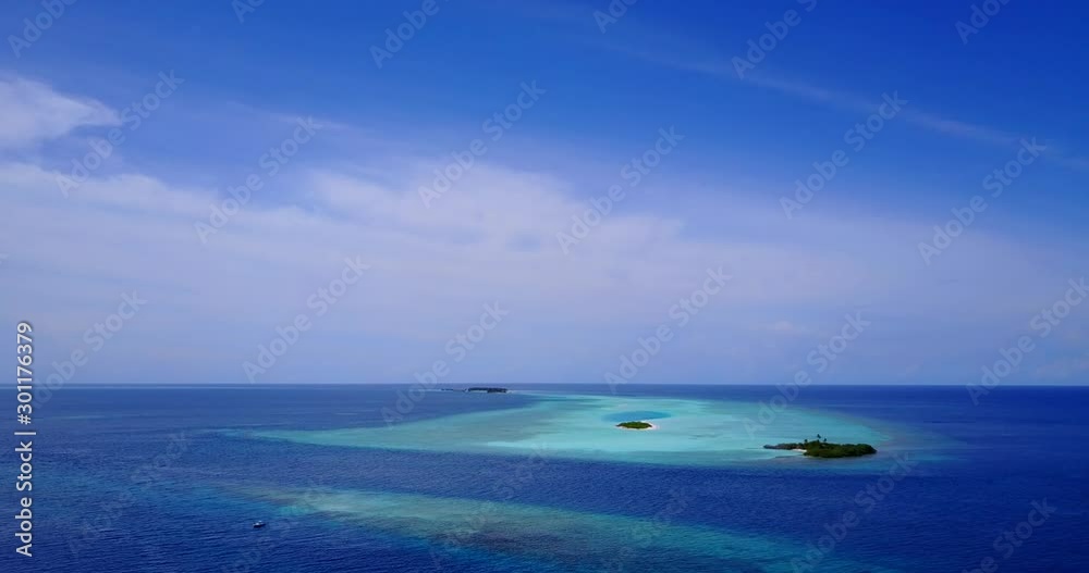 three tropical islands in middle of ocean, exotic island sits in shallow water lagoon with coral reef surrounding, Aerial three tropical islands in middle of ocean, exotic island sits in shallow water lagoon with coral reef surrounding, Aerial