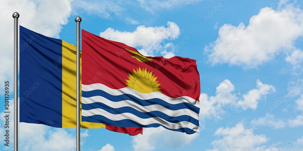 Romania and Kiribati flag waving in the wind against white cloudy blue sky together. Diplomacy concept, international relations.