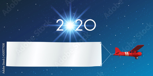 Carte de vœux 2020 sur fond de ciel étoilé, avec un avion rouge tirant une banderole blanche pour écrire un message ou souhaiter ses meilleurs vœux pour la nouvelle année.