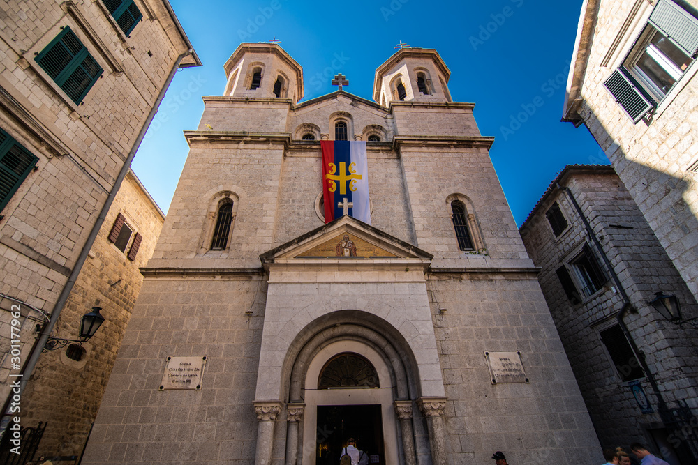 KOTOR, MONTENEGRO - JULY 2019: View on a small square in old town in Kotor, Montenegro. Kotor is town on coast of Montenegro and located on the Bay of Kotor