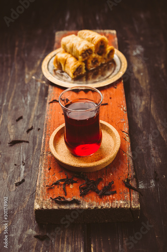 Photography delicious turkish tea and baklava on wooden table concept