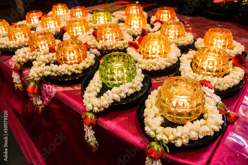 Garland jasmines with candle for Buddhist