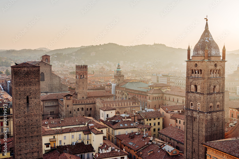 Bologna, cityscape and buildings at sunset, San Pietro Cathedral Bell Tower and San Luca hill. Emilia Romagna, Italy