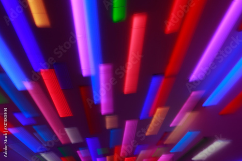 Blurred bright neon lines background. Colourful lights in motion. Abstract background with neon effects  speed theme.