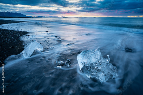 little Icebergs at sunrise in Jokulsarlon glacial lagoon. Vatnajokull National Park, southeast Iceland, Europe. Landscape photography