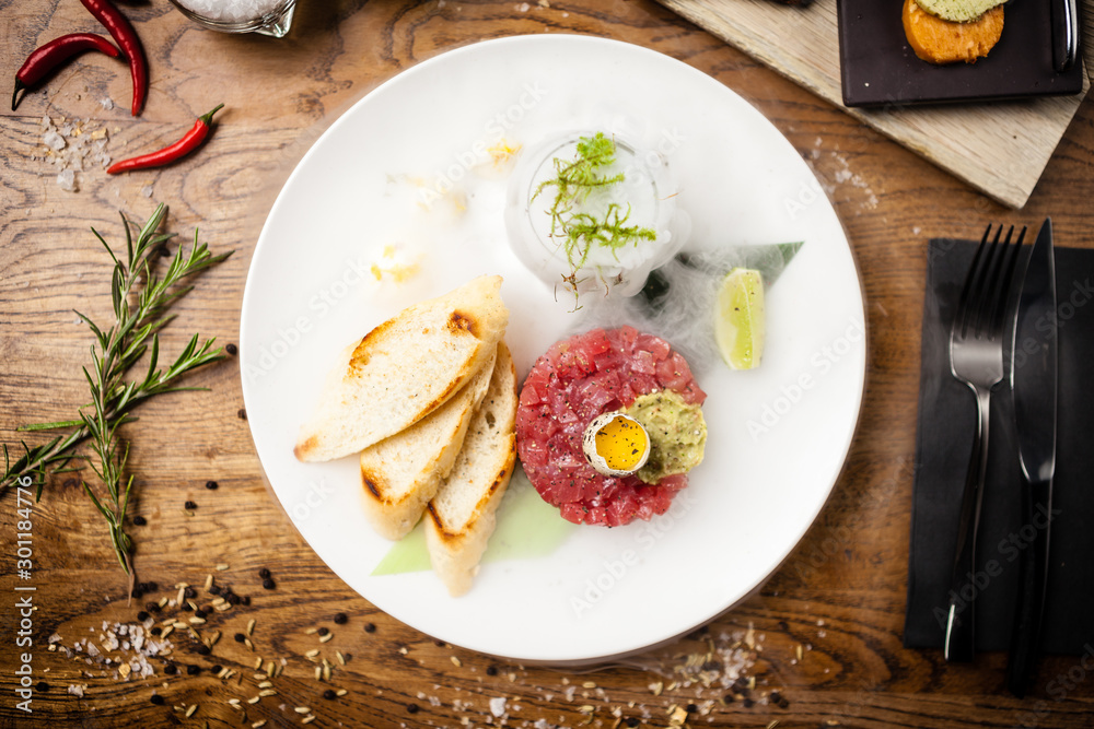 Tuna tartare served on a plate in restaurant Tuna tartare served on a plate in restaurant