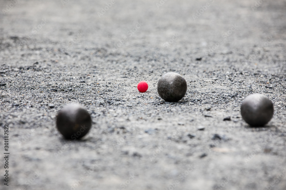 Petanque ball boules and small red jack on petanque field Stock Photo ...