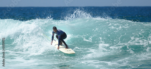 NB__9645 Young man surfing in Sagres