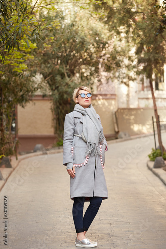 Young blond woman with sunglases on the street © sarymsakov.com
