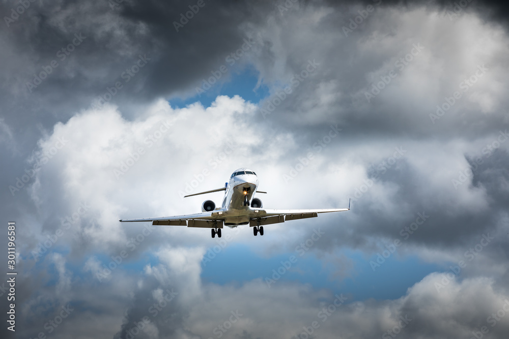 Jet airplane flying in the cloudy skies