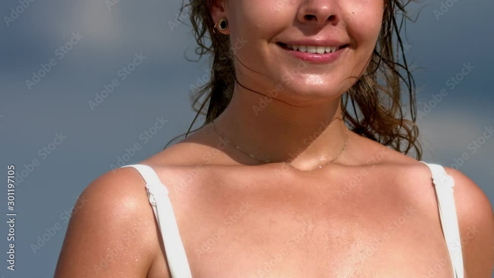 Sexy woman with beautiful tan and skin in bikini, slow motion, face partially visible. Sexy woman with beautiful tan and skin in bikini, slow motion, face partially visible.